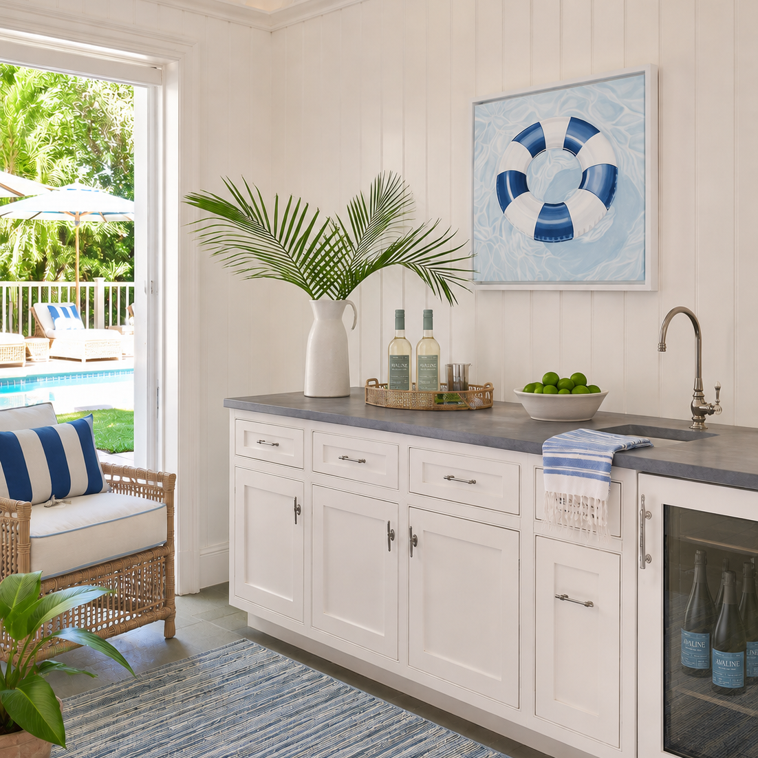 Coastal Serena & Lily inspired interior featuring the "License To Chill" original pool float painting above a built-in bar.