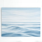 Large original ocean painting on canvas in soft blue coastal tones, inspired by calm seaside mornings.