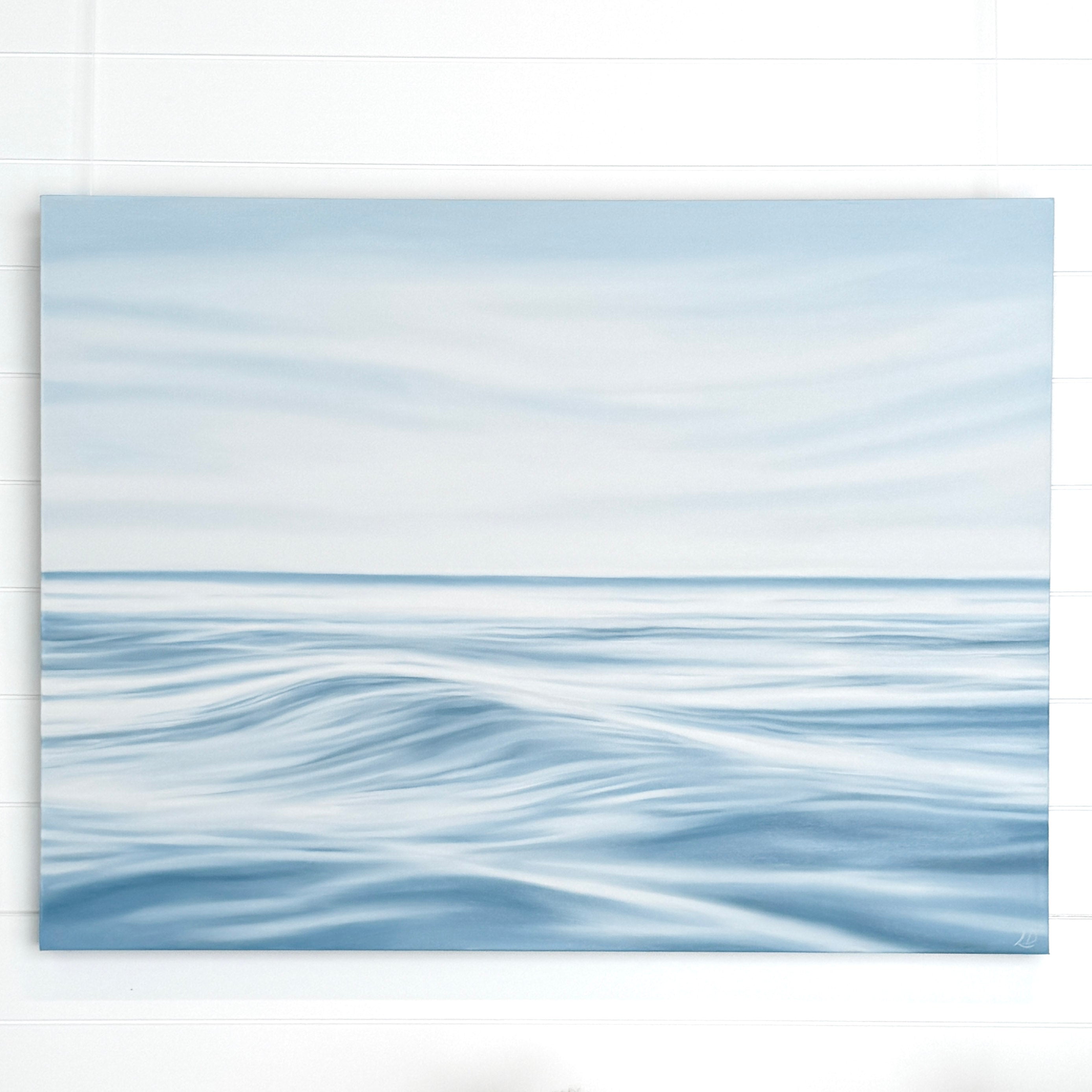Large original ocean painting on canvas in soft blue coastal tones, inspired by calm seaside mornings.